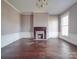 Spacious living room featuring a fireplace, hardwood floors, and large windows at 505 Camden Rd, Wadesboro, NC 28170