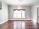 Elegant living room with hardwood floors, large windows, and soft, natural light at 505 Camden Rd, Wadesboro, NC 28170