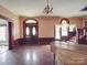 Bright living room with hardwood floors, stained glass window, and classic architectural details at 505 Camden Rd, Wadesboro, NC 28170