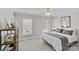 Bright bedroom with neutral walls, fan, carpet, and shelving at 5618 Camilla Dr, Charlotte, NC 28226