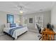 Comfortable bedroom featuring carpeted floors, ceiling fan, and large windows at 5618 Camilla Dr, Charlotte, NC 28226