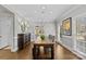 Dining room with a wooden table, chandelier, and windows at 5618 Camilla Dr, Charlotte, NC 28226