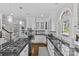 Bright kitchen features granite counters, stainless appliances, and a center island with gas cooktop at 5618 Camilla Dr, Charlotte, NC 28226