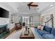 Bright living room featuring a fireplace, built-in shelves, and access to an outdoor patio at 5618 Camilla Dr, Charlotte, NC 28226