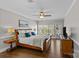 Spacious main bedroom with ceiling fan, hardwood floors, and natural light at 5618 Camilla Dr, Charlotte, NC 28226