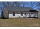 A charming back exterior with vinyl siding and a brick foundation creating a cozy and inviting space at 648 E Ketchie St, China Grove, NC 28023