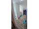 Bright bathroom features wood-look flooring, white cabinets, and a walk-in closet at 648 E Ketchie St, China Grove, NC 28023