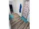 Bright bathroom with wood-look floors, a modern vanity, and a decorative shower curtain at 648 E Ketchie St, China Grove, NC 28023