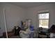 Bedroom with natural light and neutral walls, offering potential for customization and comfort at 648 E Ketchie St, China Grove, NC 28023