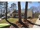 Side view of a well-maintained home with mature trees at 648 E Ketchie St, China Grove, NC 28023