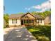 Charming single-story home featuring a concrete driveway, well-manicured lawn, and inviting curb appeal at 648 E Ketchie St, China Grove, NC 28023