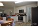 Clean kitchen with white cabinets and stainless steel appliances at 648 E Ketchie St, China Grove, NC 28023