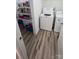 Convenient laundry room includes a full-sized washer and dryer, pantry, and wood-look flooring at 648 E Ketchie St, China Grove, NC 28023
