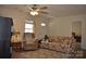 Welcoming living room featuring a ceiling fan, patterned furniture, and ample space for relaxation at 648 E Ketchie St, China Grove, NC 28023