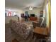 Comfortable living room with hardwood flooring, ceiling fan, with easy access to the kitchen and dining area at 648 E Ketchie St, China Grove, NC 28023