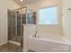 Luxurious bathroom boasts a soaking tub and separate glass shower at 7015 Walnut Branch Ln, Charlotte, NC 28277