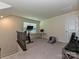 Upper level bonus room featuring fitness bike and work space at 7015 Walnut Branch Ln, Charlotte, NC 28277