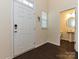Welcoming entryway with a view into the adjacent half bathroom at 7015 Walnut Branch Ln, Charlotte, NC 28277