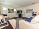 Bright living room showcasing hardwood floors, fireplace, and ample seating at 7015 Walnut Branch Ln, Charlotte, NC 28277