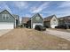 Rear view of home with back garage and driveway parking at 7015 Walnut Branch Ln, Charlotte, NC 28277