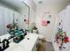 Bright bathroom featuring a double sink vanity, large mirror, and a shower/tub combination at 7204 Cranswick Pl, Charlotte, NC 28227