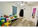 Cozy bedroom with ceiling fan, closet, and neutral paint at 7204 Cranswick Pl, Charlotte, NC 28227