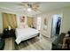 Cozy bedroom with light gray walls, wood-look flooring, and a ceiling fan at 7204 Cranswick Pl, Charlotte, NC 28227