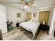 Comfortable bedroom featuring a ceiling fan, wood-look flooring, and neutral walls at 7204 Cranswick Pl, Charlotte, NC 28227