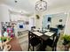 Eat-in kitchen and dining area features modern light fixture and is open to a living room space at 7204 Cranswick Pl, Charlotte, NC 28227