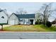 Charming single-story home featuring a manicured front lawn and a classic design at 7204 Cranswick Pl, Charlotte, NC 28227