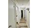Hallway features neutral walls and flows to bathroom and bedrooms at 7204 Cranswick Pl, Charlotte, NC 28227
