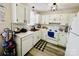 Well-lit kitchen features white cabinets, modern subway tile backsplash, and stainless steel appliances at 7204 Cranswick Pl, Charlotte, NC 28227