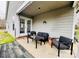 Charming covered patio with comfortable seating and access to the yard at 7204 Cranswick Pl, Charlotte, NC 28227
