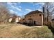 Spacious backyard featuring a patio and mature trees, offering plenty of room for outdoor activities at 7435 Trotter Rd, Charlotte, NC 28216