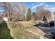 Large backyard with patio area, lush greenery, and mature trees, perfect for outdoor living at 7435 Trotter Rd, Charlotte, NC 28216