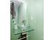 Chic bathroom features a vessel sink on a glass shelf with a decorative mirror at 7435 Trotter Rd, Charlotte, NC 28216