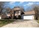 Well-maintained home with an attached two-car garage, set on a spacious lot, with a lush green lawn at 7435 Trotter Rd, Charlotte, NC 28216