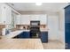 Kitchen featuring stainless appliances, stylish countertops, and white and navy cabinetry at 7435 Trotter Rd, Charlotte, NC 28216