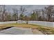 Large backyard with a white fence and a storage shed at 8055 Hereford St, Charlotte, NC 28213