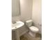 Modern powder room featuring white fixtures and neutral wall paint at 8055 Hereford St, Charlotte, NC 28213