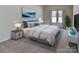 Well-lit bedroom showcasing a comfortable bed, stylish decor and neutral colors at 8055 Hereford St, Charlotte, NC 28213