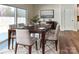Dining area with a modern table set, elegant chairs, neutral tones, and stylish decor at 8055 Hereford St, Charlotte, NC 28213
