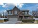 Charming two-story home featuring a stone-accented entrance, attached garage, and well-maintained landscaping at 8055 Hereford St, Charlotte, NC 28213