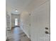 Bright hallway with neutral walls, wainscoting detail, and hardwood-style floors at 8055 Hereford St, Charlotte, NC 28213