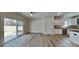 Open-concept kitchen and dining area with sliding doors and white cabinetry at 8055 Hereford St, Charlotte, NC 28213