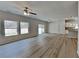 Spacious living and dining area with modern floors, white walls, and plenty of natural light at 8055 Hereford St, Charlotte, NC 28213