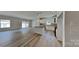 Open-concept living space with kitchen island, modern appliances, and dining area at 8055 Hereford St, Charlotte, NC 28213