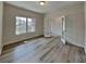 Bright office space with hardwood-style floors, a window, and glass french doors at 8055 Hereford St, Charlotte, NC 28213