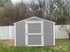 Grey storage shed with white trim in a fenced backyard at 8055 Hereford St, Charlotte, NC 28213
