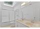 Bright bathroom featuring double sinks, a shower-tub, and lots of natural light at 8731 Sheltonham Way, Charlotte, NC 28216